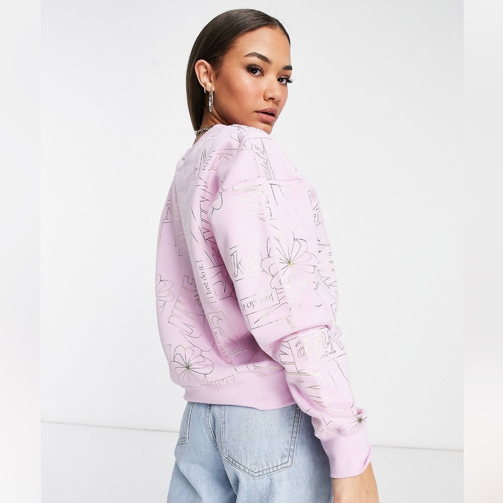 Nike icon clash fleece sweatshirt in pink with all-over logo print